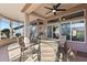 Relaxing sunroom with patio furniture and view of backyard at 14137 W Via Manana --, Sun City West, AZ 85375