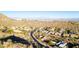 Aerial view of luxury homes nestled in a desert landscape with mountain views at 14597 E Corrine Dr, Scottsdale, AZ 85259