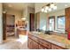 Elegant bathroom with double vanity, tile flooring and large mirror at 14597 E Corrine Dr, Scottsdale, AZ 85259