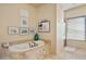 Bathroom featuring a large soaking tub and walk-in shower at 14597 E Corrine Dr, Scottsdale, AZ 85259