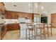 Kitchen with island, wood cabinets, and breakfast bar at 14597 E Corrine Dr, Scottsdale, AZ 85259