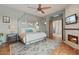 Main bedroom with fireplace, hardwood floors, and ensuite bath at 14597 E Corrine Dr, Scottsdale, AZ 85259