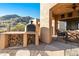 Outdoor kitchen with wood-fired oven, perfect for entertaining at 14597 E Corrine Dr, Scottsdale, AZ 85259