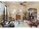 Cozy sitting area featuring comfortable armchairs and built-in shelving at 14597 E Corrine Dr, Scottsdale, AZ 85259