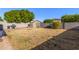 Landscaped backyard with a storage shed at 14749 N 153Rd Dr, Surprise, AZ 85379