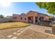 Landscaped backyard with a hot tub and patio at 14749 N 153Rd Dr, Surprise, AZ 85379