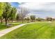 Well-manicured community park with walking paths and benches at 14749 N 153Rd Dr, Surprise, AZ 85379