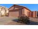 Attached two-car garage with a gate to the side yard at 14749 N 153Rd Dr, Surprise, AZ 85379