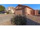 Attached two-car garage with a gate to the side yard at 14749 N 153Rd Dr, Surprise, AZ 85379