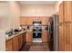 Kitchen features stainless steel appliances and wood cabinets at 14749 N 153Rd Dr, Surprise, AZ 85379