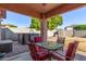 Covered patio with seating area, adjacent to hot tub at 14749 N 153Rd Dr, Surprise, AZ 85379