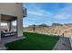 Artificial turf backyard with mountain views and patio seating at 14840 E Valley Vista Dr, Fountain Hills, AZ 85268