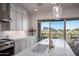 Modern kitchen with a large island, white cabinets, and mountain views at 14840 E Valley Vista Dr, Fountain Hills, AZ 85268