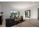 Bright living room with hardwood floors and sliding doors to a view at 14840 E Valley Vista Dr, Fountain Hills, AZ 85268