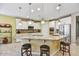 Large kitchen with granite island, white cabinets, and stainless steel appliances at 15813 N 109Th Ln, Sun City, AZ 85351