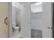 Bathroom with toilet, shower, and walk-in closet at 17242 N 16Th Dr # 9, Phoenix, AZ 85023