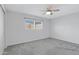 Bright bedroom with ceiling fan and gray carpet at 17242 N 16Th Dr # 9, Phoenix, AZ 85023