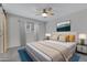 Bedroom with a beige comforter and barn door at 17242 N 16Th Dr # 9, Phoenix, AZ 85023