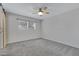 Well-lit bedroom featuring a ceiling fan and a window with a view of the outdoors at 17242 N 16Th Dr # 9, Phoenix, AZ 85023