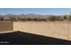 Backyard with block wall and mountain views at 17330 W Royal Palm Rd, Waddell, AZ 85355