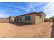 View of home's exterior and backyard, showcasing a large lot at 17330 W Royal Palm Rd, Waddell, AZ 85355