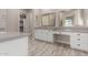 Modern bathroom with double vanity and large mirror at 17330 W Royal Palm Rd, Waddell, AZ 85355