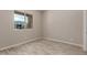 Light and airy bedroom with wood-look flooring at 17330 W Royal Palm Rd, Waddell, AZ 85355