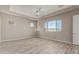 Bright bedroom with wood-look floors and large window at 17330 W Royal Palm Rd, Waddell, AZ 85355