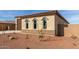 New construction home with a two-car garage and desert landscaping at 17330 W Royal Palm Rd, Waddell, AZ 85355