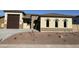 New construction home with a two-car garage and desert landscaping at 17330 W Royal Palm Rd, Waddell, AZ 85355