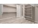 Spacious walk-in closet with ample shelving and hanging rods at 17330 W Royal Palm Rd, Waddell, AZ 85355