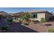 Landscaped backyard with artificial turf and desert plants at 18147 W Sandy Rd, Goodyear, AZ 85338