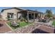 Spacious backyard with pergola, artificial turf and rock landscaping at 18147 W Sandy Rd, Goodyear, AZ 85338