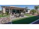 Relaxing backyard oasis with pergola, seating area, and artificial turf at 18147 W Sandy Rd, Goodyear, AZ 85338