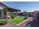 Artificial turf, desert landscaping, and a pergola with seating at 18147 W Sandy Rd, Goodyear, AZ 85338