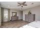 Spacious bedroom with large dresser and ceiling fan at 18147 W Sandy Rd, Goodyear, AZ 85338