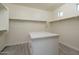 Walk-in closet with built-in shelving and drawers at 18147 W Sandy Rd, Goodyear, AZ 85338