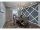 Formal dining room with elegant chandelier and geometric wall design at 18147 W Sandy Rd, Goodyear, AZ 85338