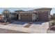 Beautiful two-story home with a three-car garage and landscaped front yard at 18147 W Sandy Rd, Goodyear, AZ 85338