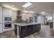 Island kitchen with stainless steel appliances and granite countertops at 18147 W Sandy Rd, Goodyear, AZ 85338