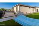 Blue striped hammock and built in BBQ in this backyard paradise at 18280 N Piccolo Dr, Maricopa, AZ 85138