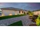 Artificial turf and stone backyard with lighting at 18280 N Piccolo Dr, Maricopa, AZ 85138