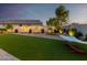 Artificial turf and stone backyard with hammock at 18280 N Piccolo Dr, Maricopa, AZ 85138