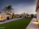 Landscaped backyard with artificial turf and hammock at 18280 N Piccolo Dr, Maricopa, AZ 85138