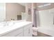 Clean bathroom, featuring a bathtub and white vanity at 18280 N Piccolo Dr, Maricopa, AZ 85138