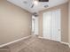 Spacious bedroom with neutral walls and carpet flooring at 18280 N Piccolo Dr, Maricopa, AZ 85138