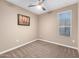 Simple bedroom with neutral decor and ceiling fan at 18280 N Piccolo Dr, Maricopa, AZ 85138