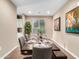 Elegant dining room with dark wood table and six gray chairs at 18280 N Piccolo Dr, Maricopa, AZ 85138