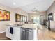 Kitchen with island, granite countertops, and views into Gathering room at 18280 N Piccolo Dr, Maricopa, AZ 85138