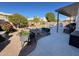 Relaxing backyard oasis with a sparkling pool, patio furniture, and mature landscaping at 1878 E Oasis Dr, Tempe, AZ 85283